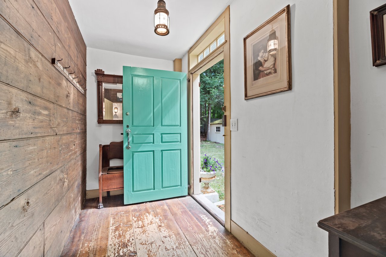 Restored wide pine board walls reflect the practicality and resourcefulness of 17th century home builders.