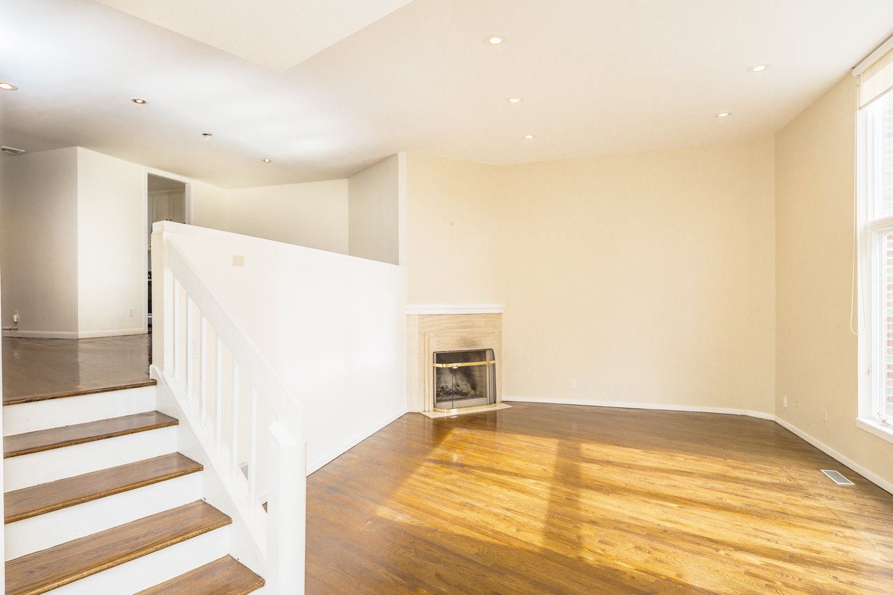 The WOW factor. The light shines bright in this double height living room. Wood burning fireplace for your fall and winter enjoyment.