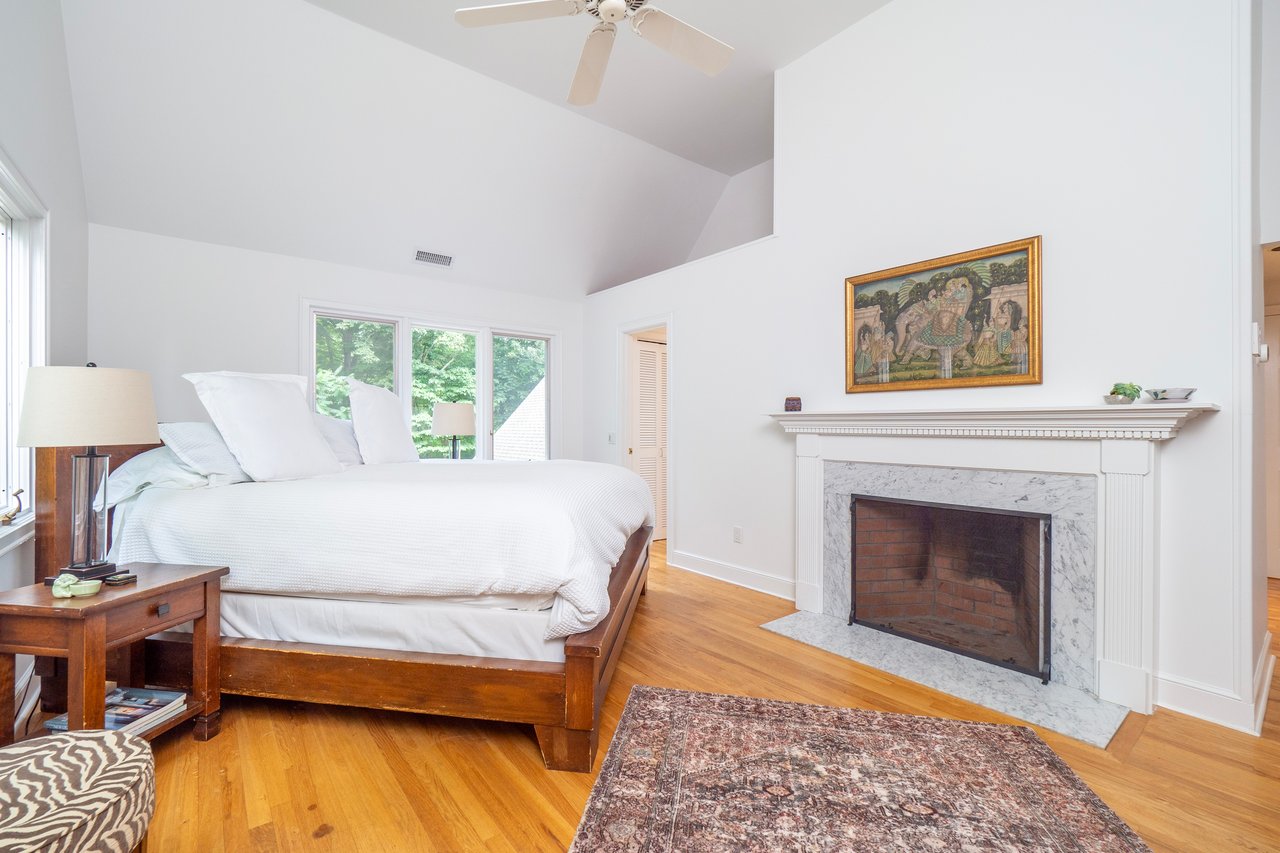 Main bedroom with wood burning fireplace	