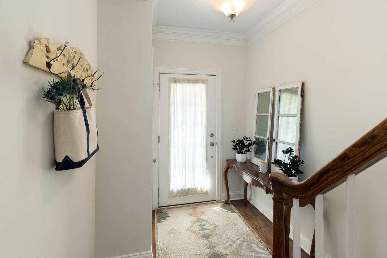 The front entrance leads to foyer with closet storage and garage access.