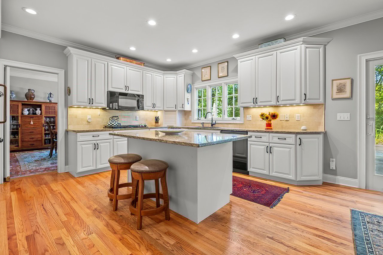 Large eat-in kitchen that flows to the family room and also leads too the patio and pool.	