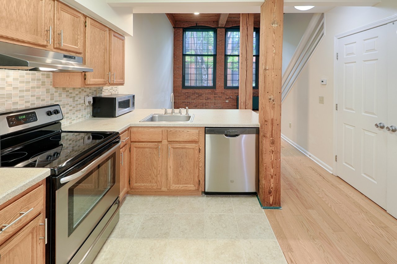 The kitchen is fully open to the great room and it's high ceilings, as seen here.