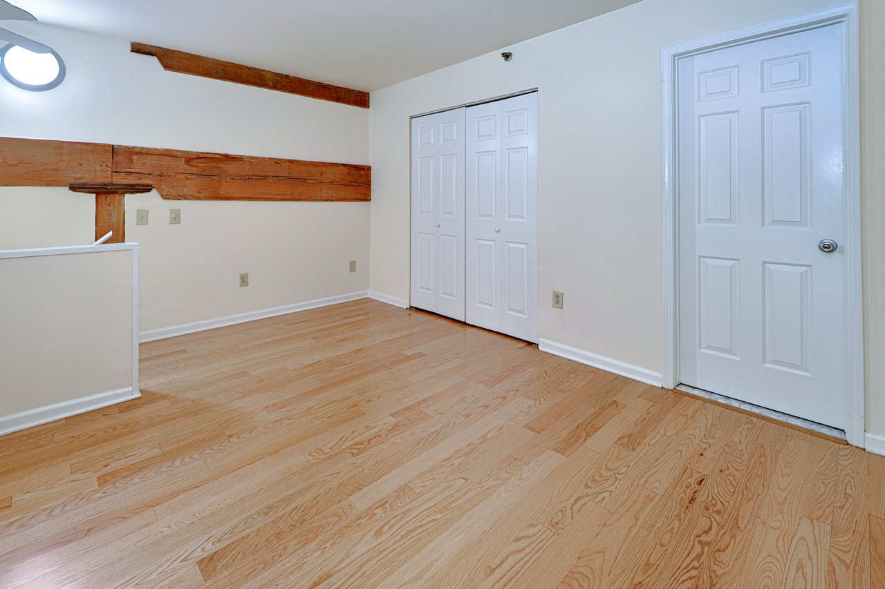 At the top of the stairs is a large double closet, and the door to the full bath.