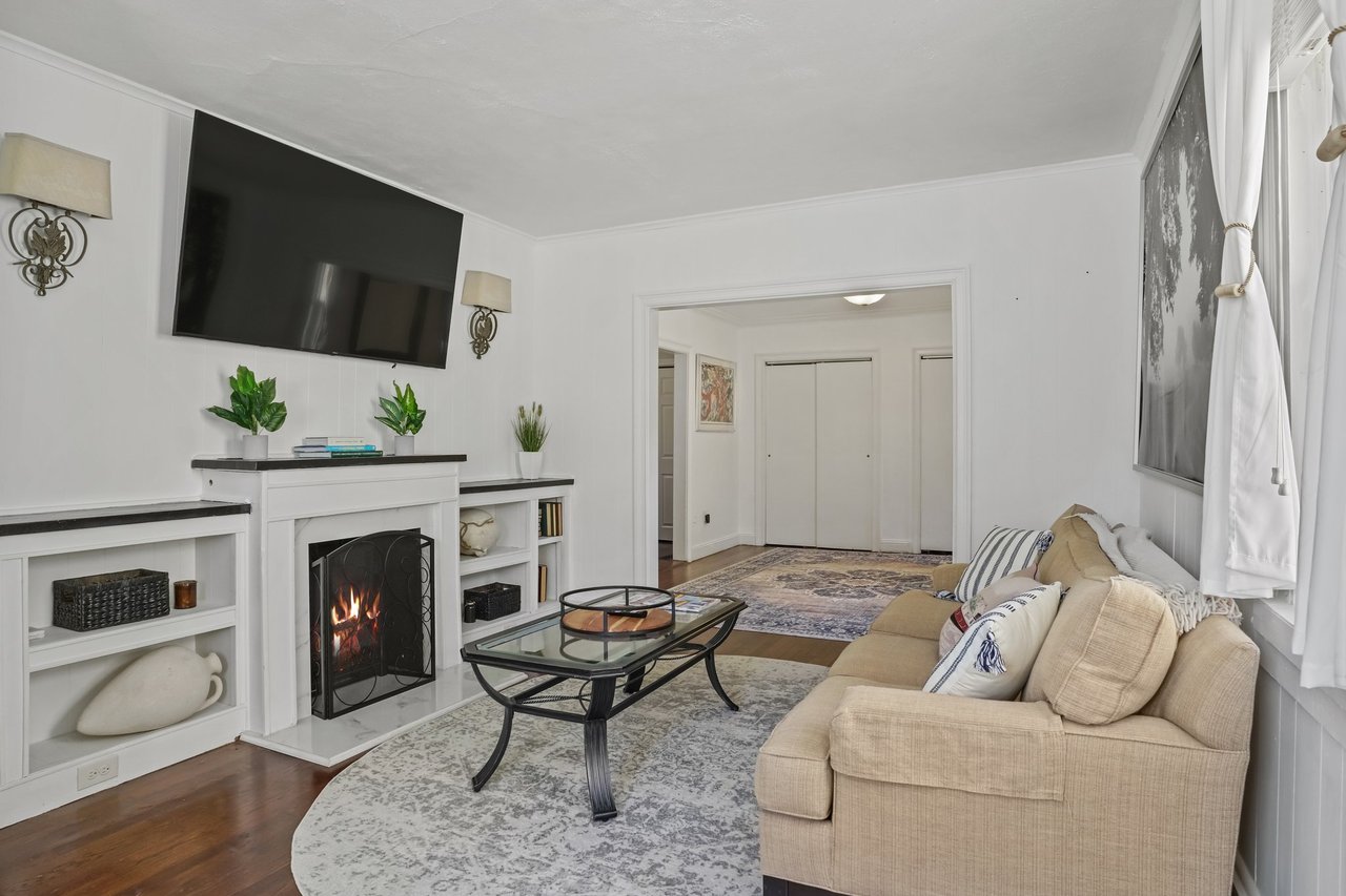 Spacious living room with faux fireplace