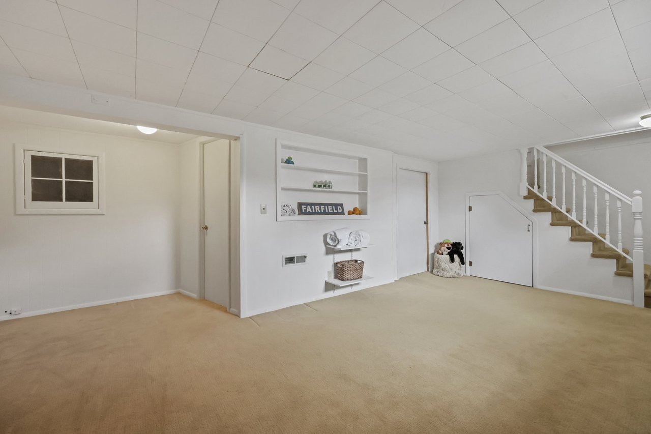 Lower level play area, laundry and hobby room (not shown).