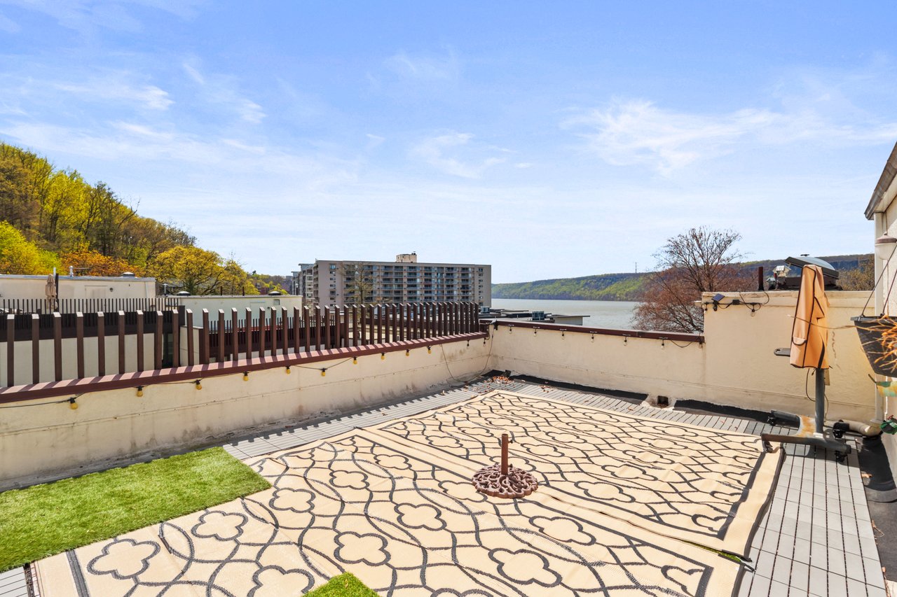 View of roof deck featuring a river view