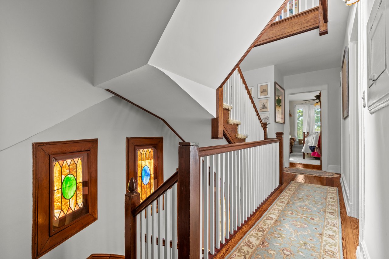 Corridor with stairs and amazing stained glass windows