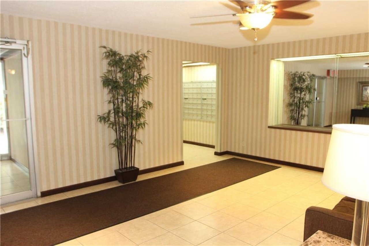 The lobby is inviting and meticulous - with seating and a mail room for packages....