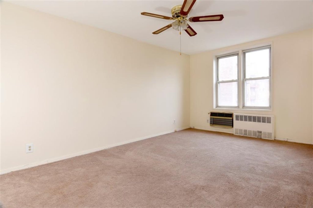 An expansive bedroom holds plenty of space for a king-sized bedroom set....