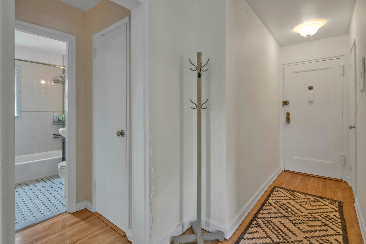 Hall featuring baseboards and light wood-style floors