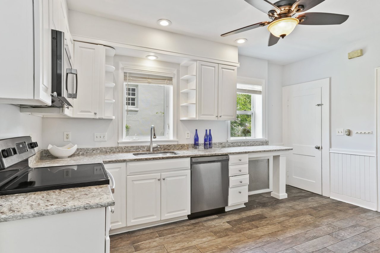 Kitchen with newer stainless steel appliances and flooring
