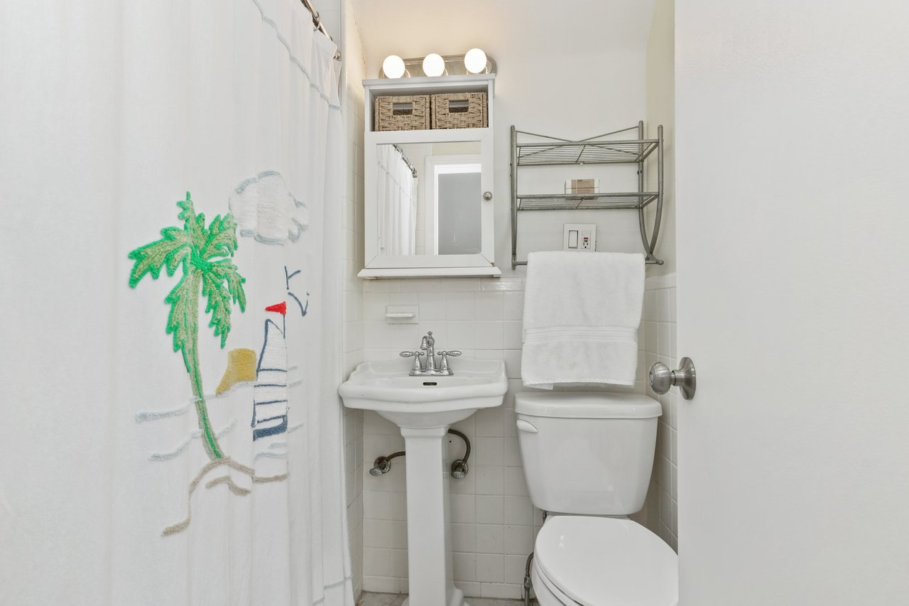 Half full bath at top of stairs