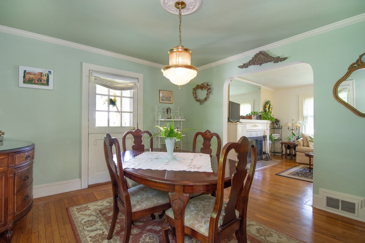 The dining room boasts of arched walkways, ornamental molding and classic baseboards....