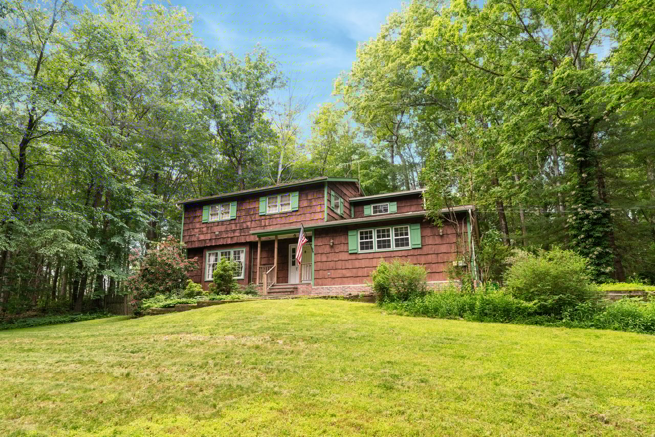 View of front of property with a front yard