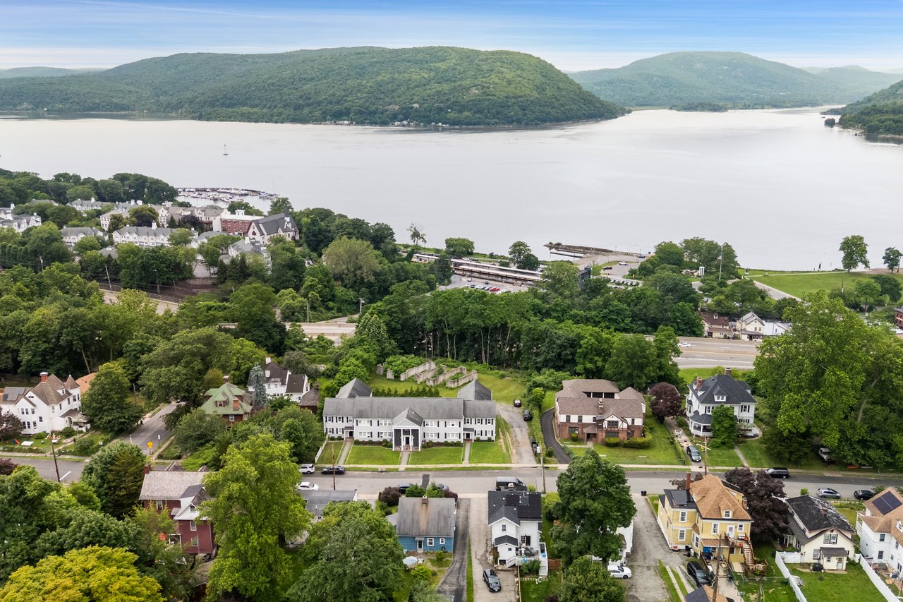 Aerial view of residential area with a water and mountain view