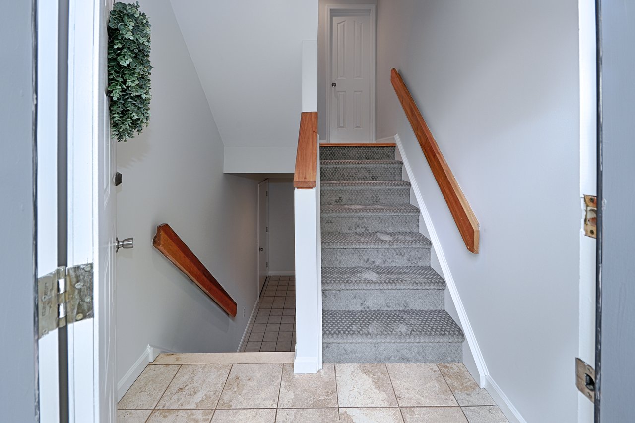 Entrance to 2B showing stairs to main and lower levels.
