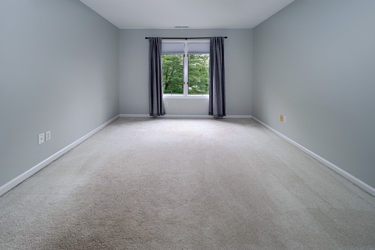 Second bedroom on upper level. Perfect for home office or bedroom.