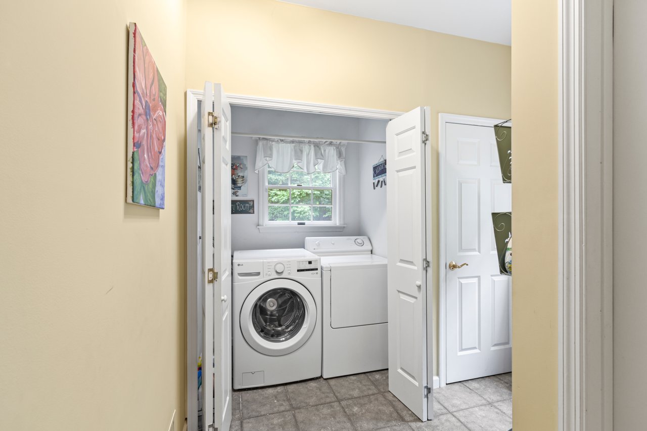 Laundry Room on first floor off Kitchen with washing machine and clothes dryer