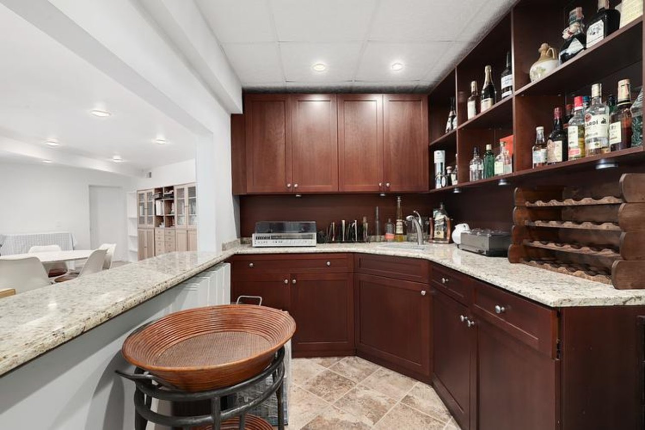 Bar with recessed lighting and a paneled ceiling