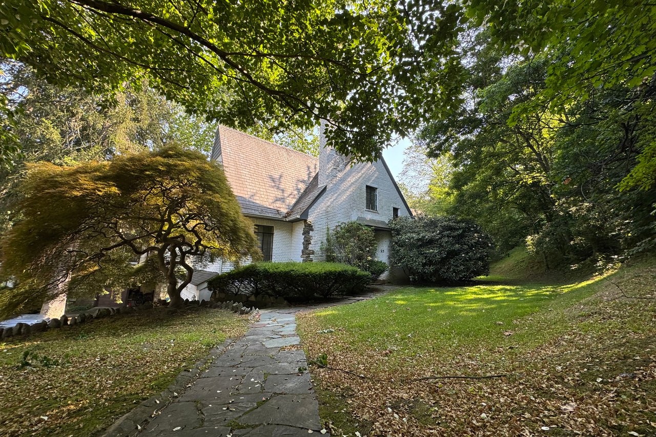 View of home's exterior with a lawn