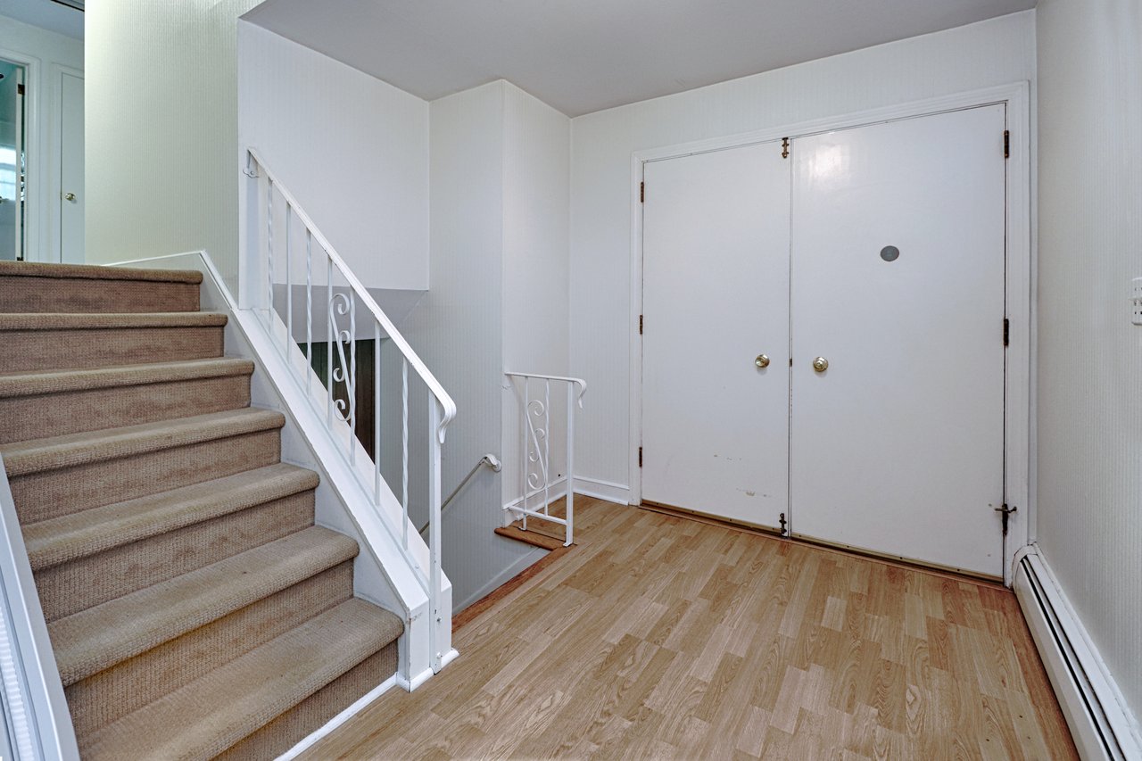Alternate view of foyer and stairs to upper level. 