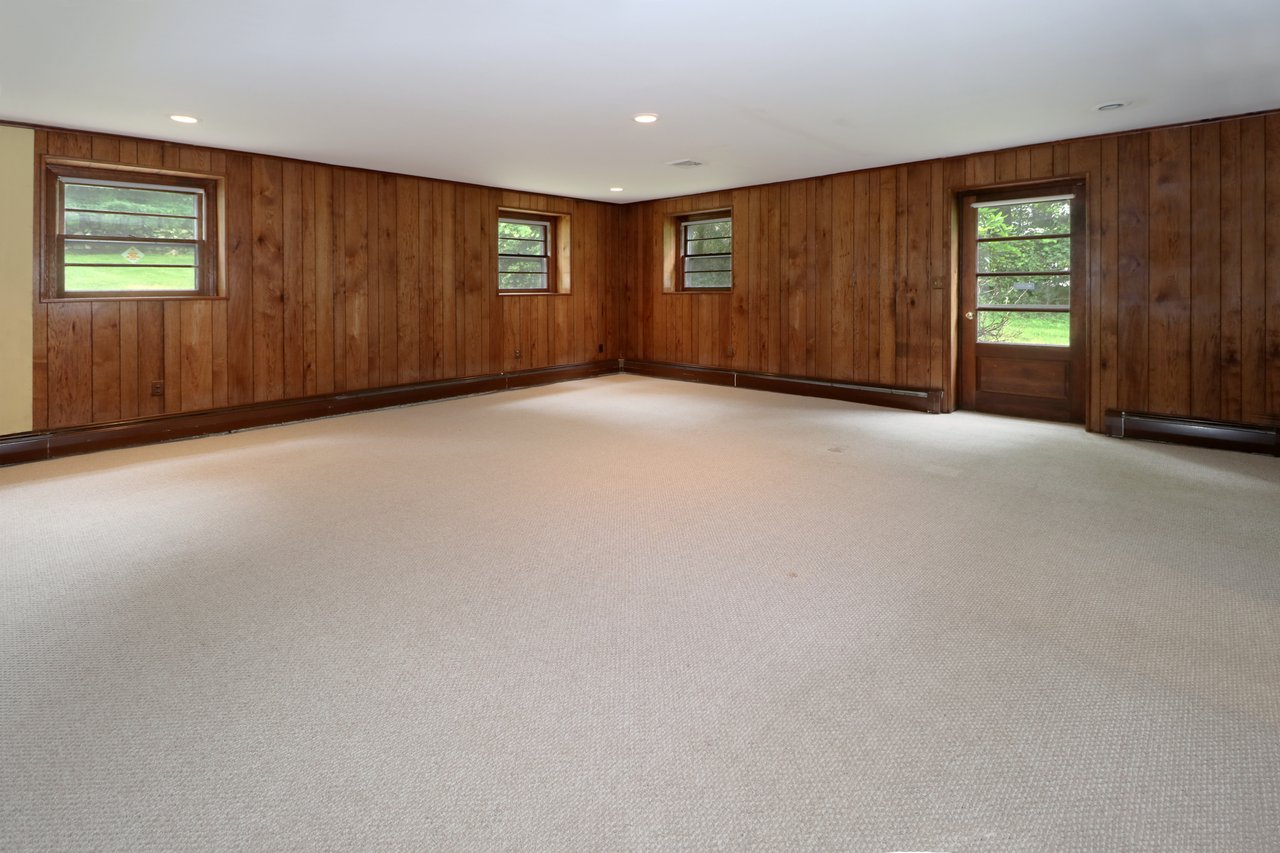 Large lower level recreation room with separate entrance.