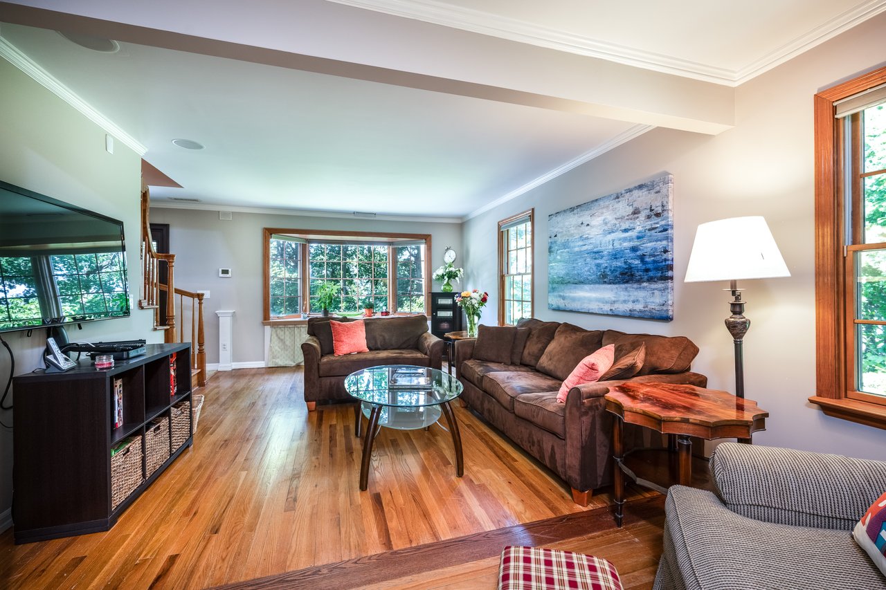 Another view of living room. Seasonal Hudson River views from the bay window.