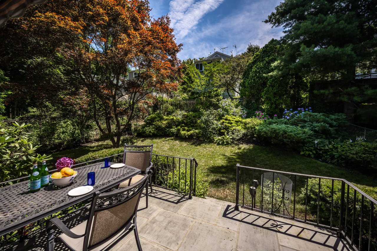 View of patio / terrace featuring al fresco dining and beautifully landscaped fenced in yard.