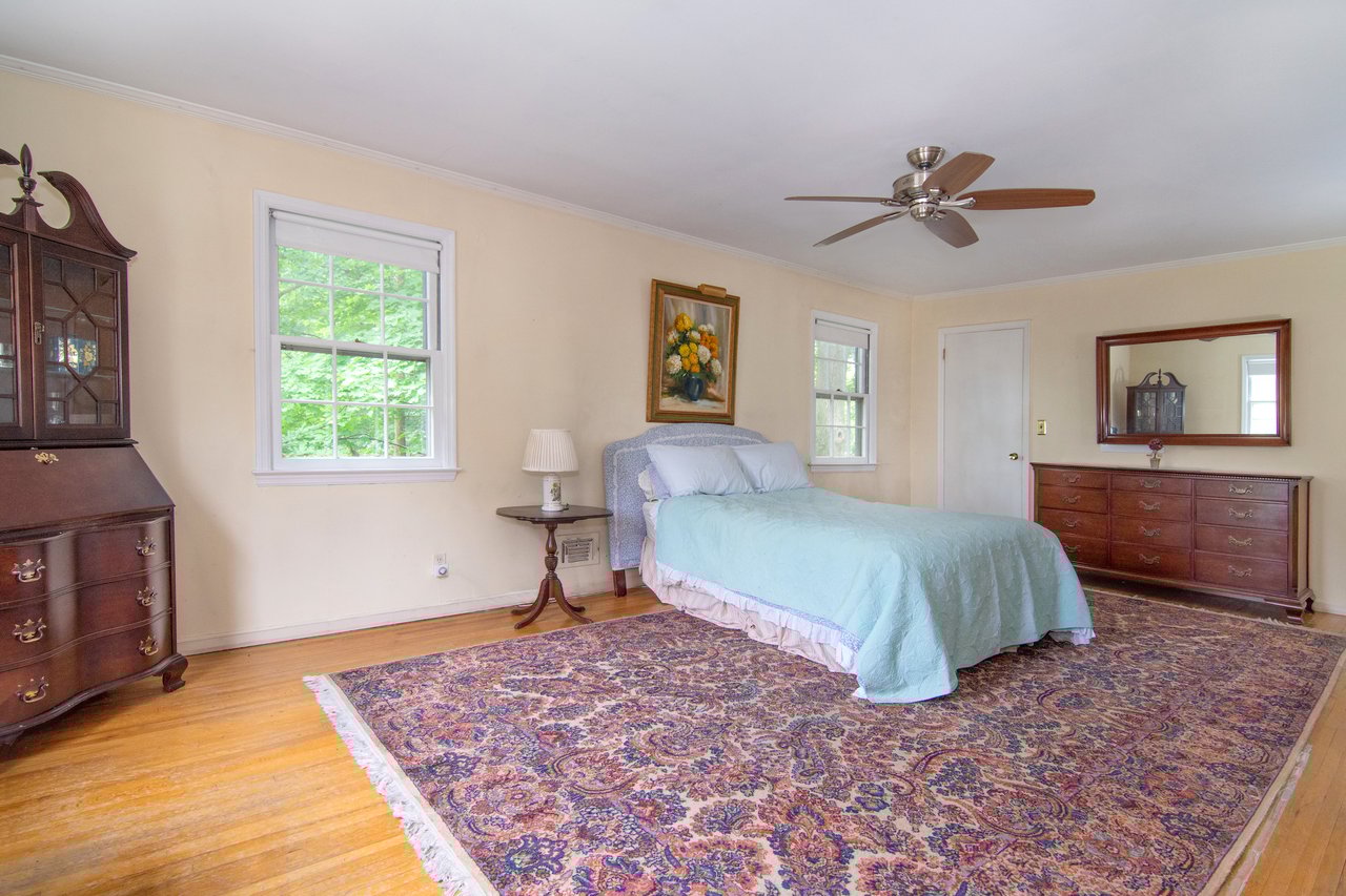Hardwood floors, two large closets and a full bath complete the master suite.