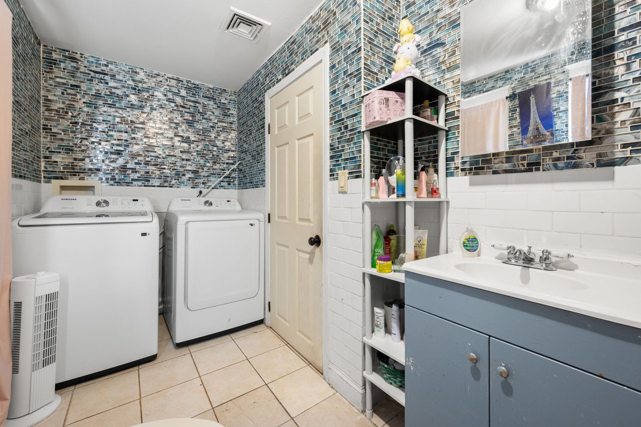 Upper level laundry off the full bathroom.