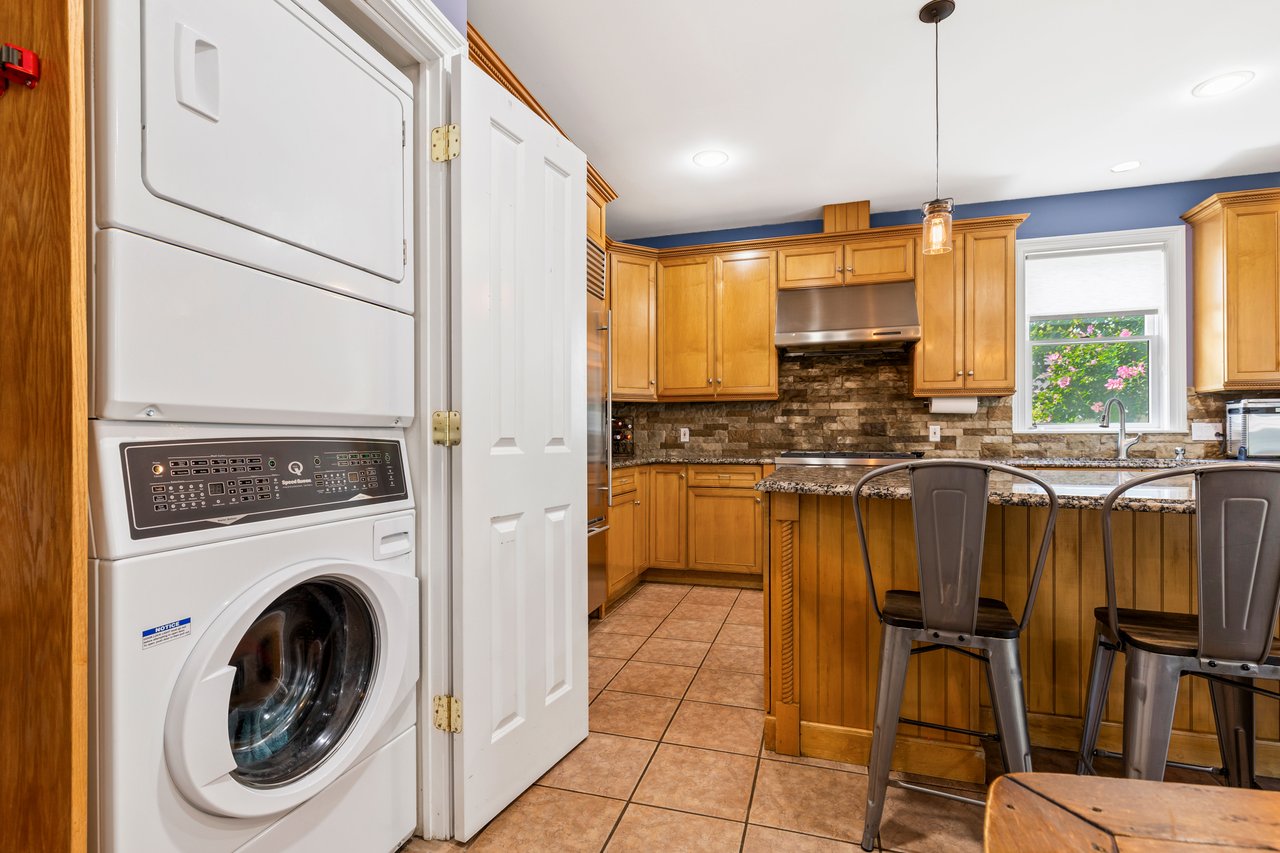 Stackable full size washer and dryer in kitchen laundry closet