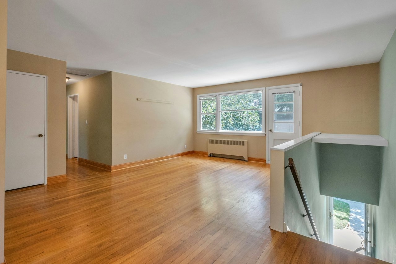 Featuring recessed radiator and hardwood-floors