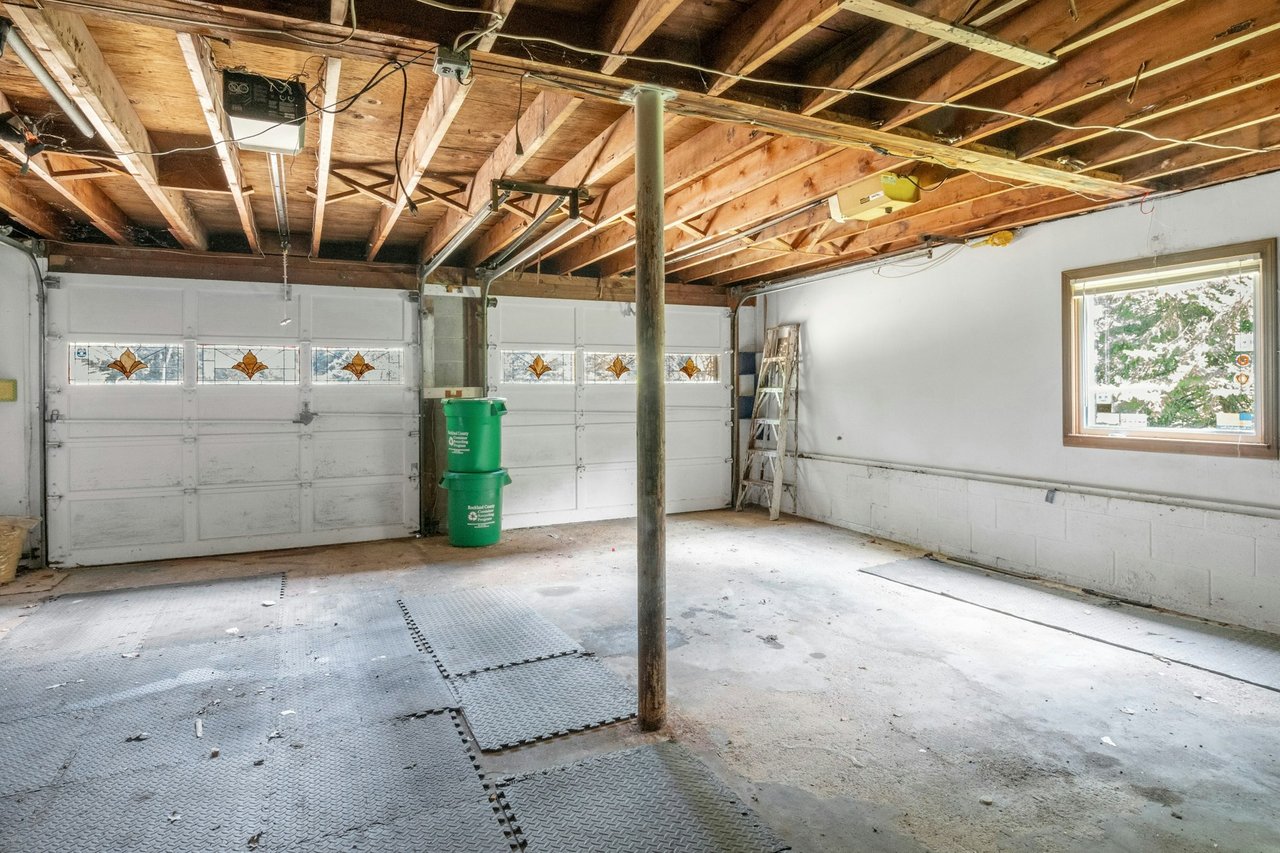 Garage featuring a garage door opener