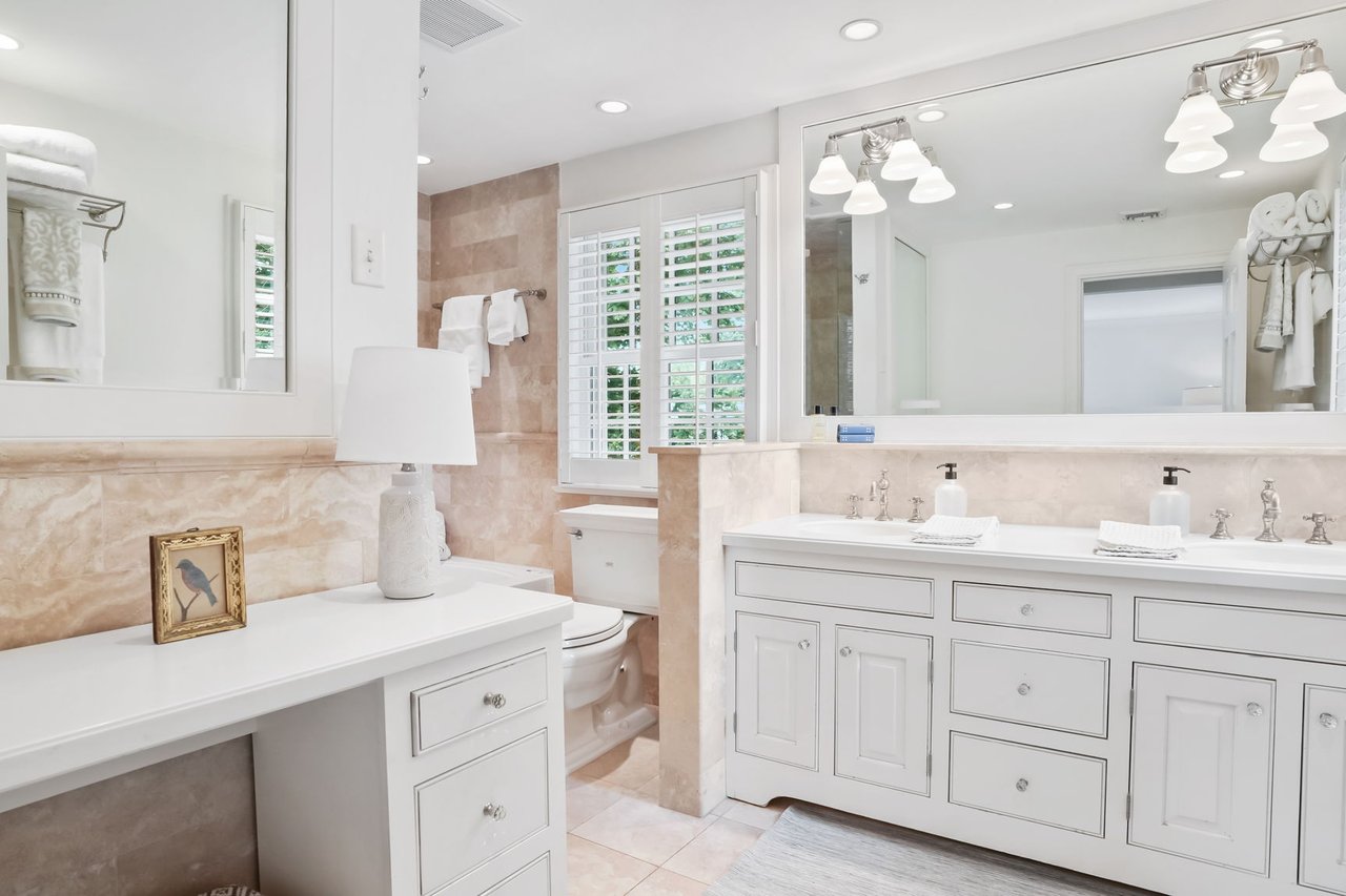 Primary Bath with Tavertine Tile and built-in make up area