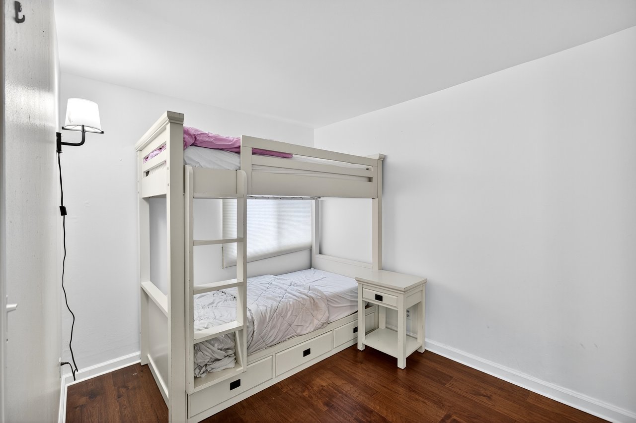 2nd Bedroom with dark wood finished floors