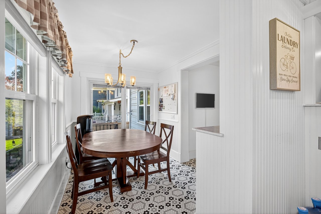 Dining area in the Eat-In-Kitchen with sliders to the stone patio and backyard