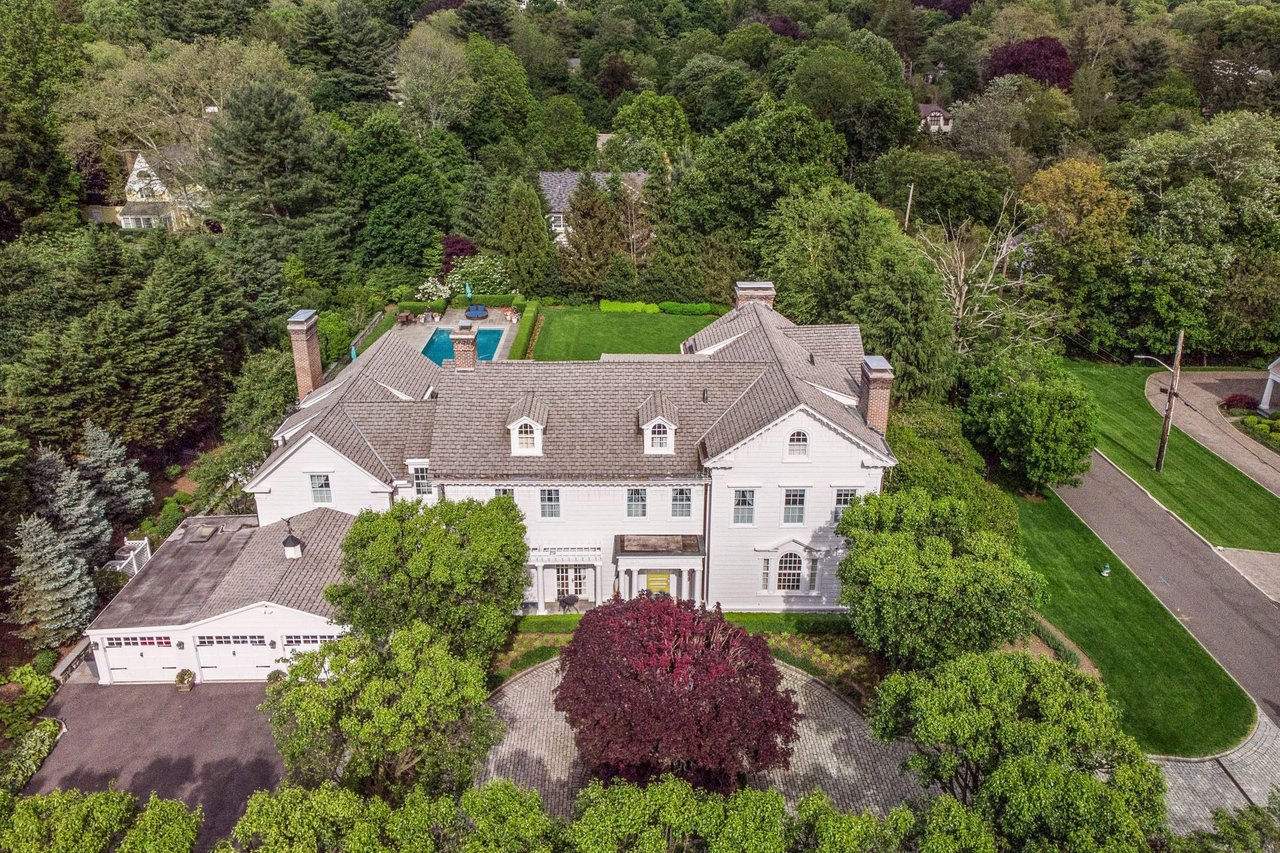 Resort style set on an acre of meticulously manicured property in Ardsley Park!