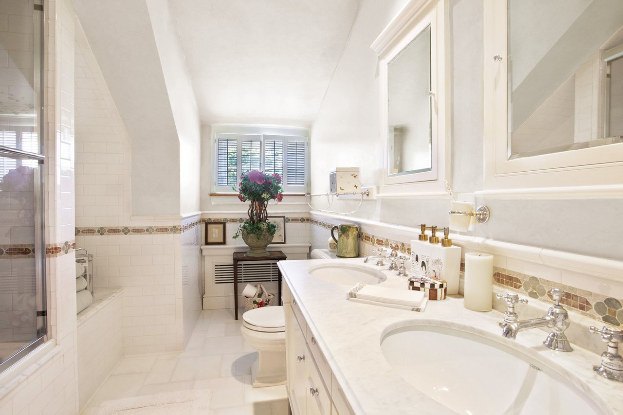 Second floor full bathroom with double vanity.