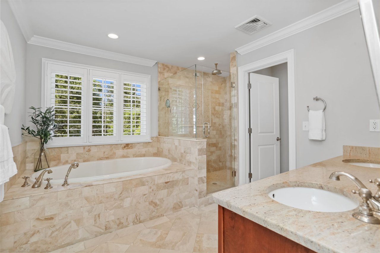 Large primary bathroom with shower and whirlpool tub