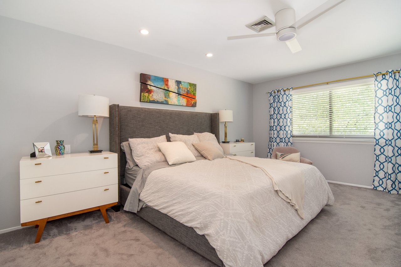 Bedroom featuring a ceiling fan, and recessed lighting....
