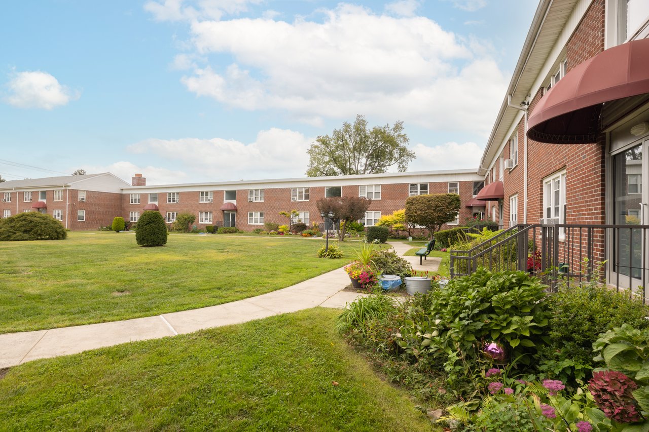 View of property's community with a yard and a residential view