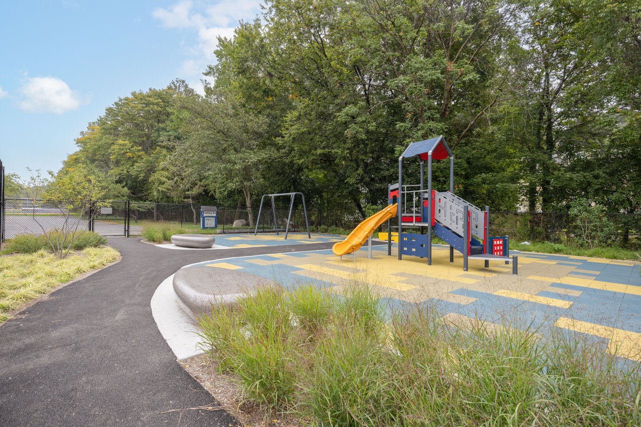 Communal playground with view of scattered trees