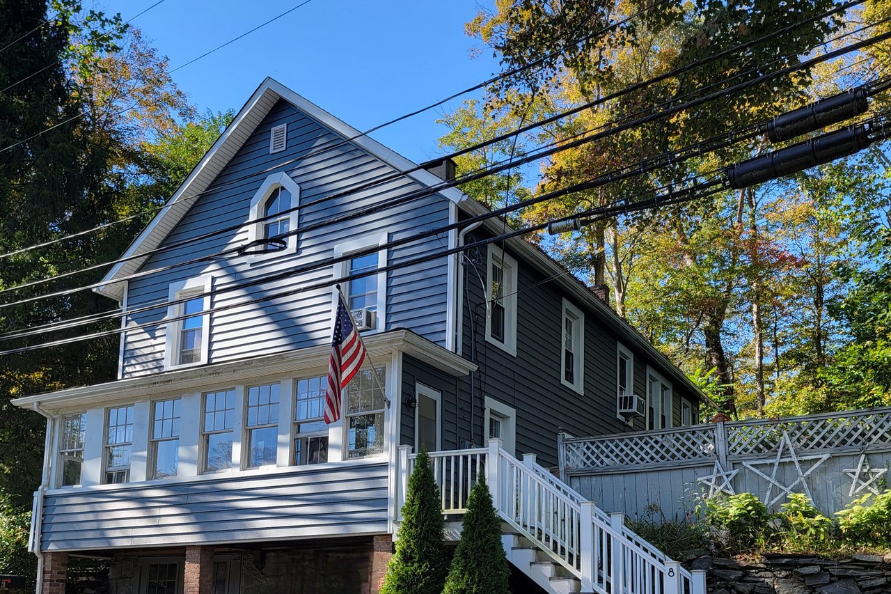 Two-family in Chester Village with off-street parking.
