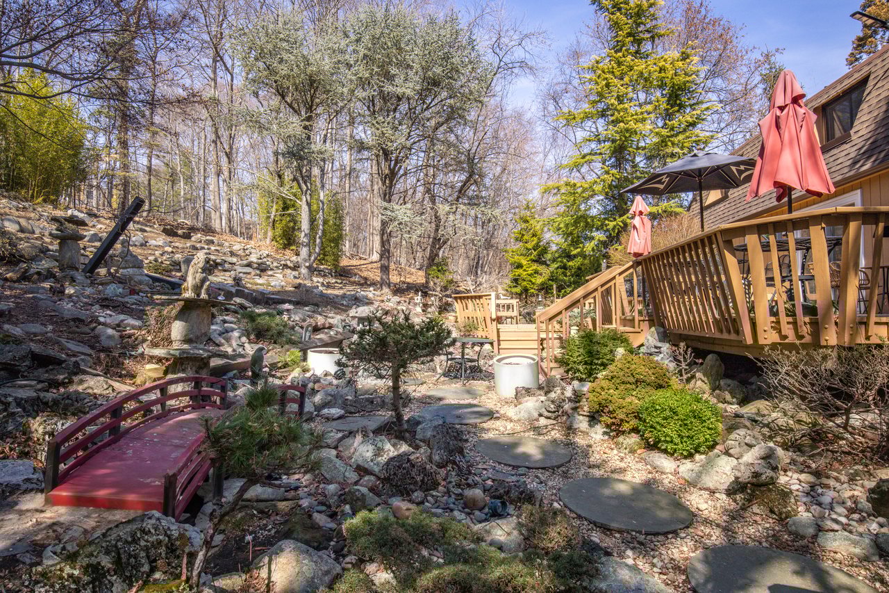 View of yard with a wooden deck
