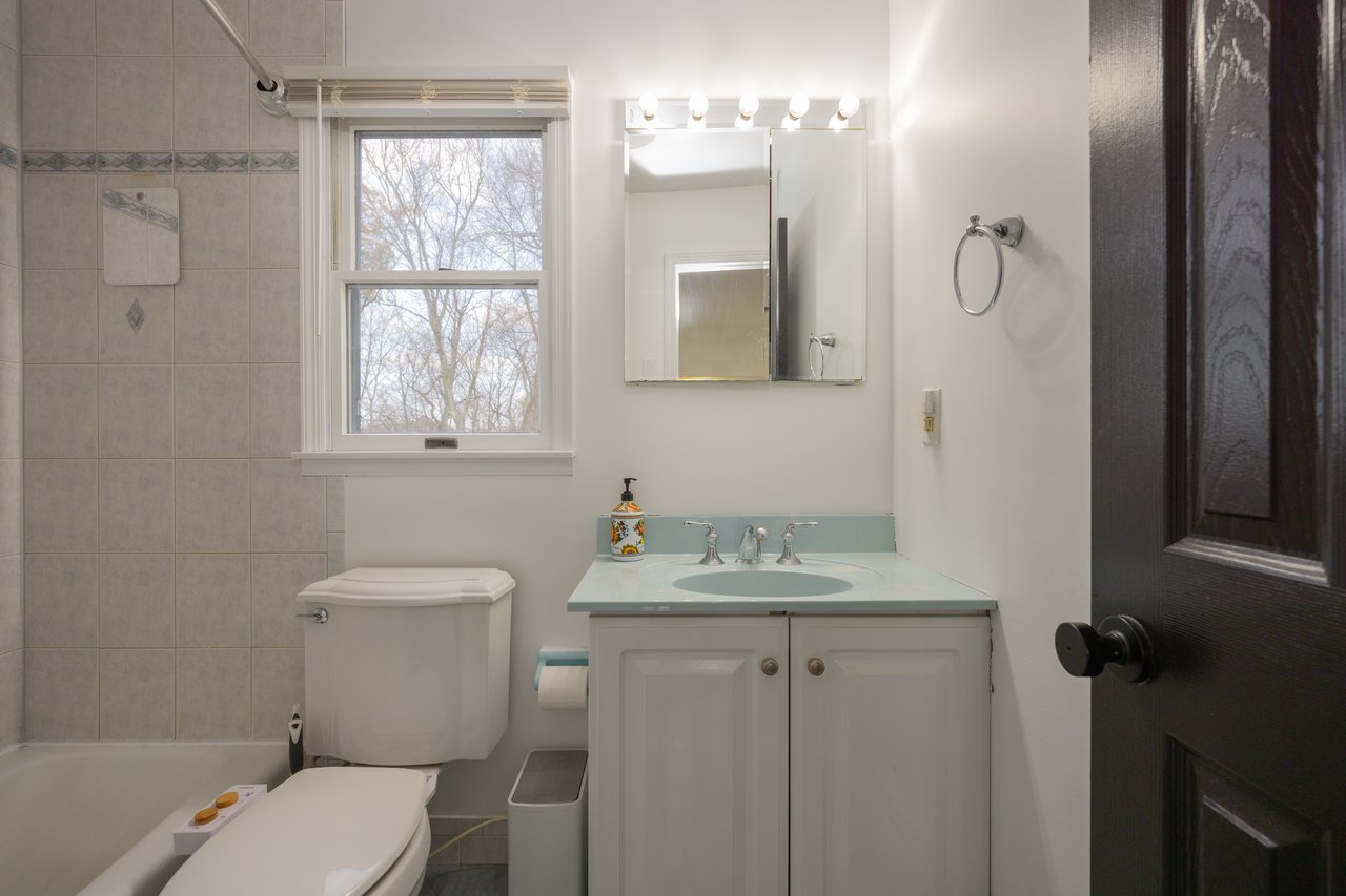 Bathroom featuring vanity and bathtub / shower combination