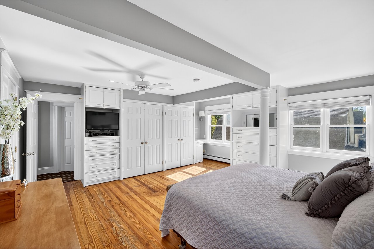 Bedroom featuring multiple closets, and lots of natural light