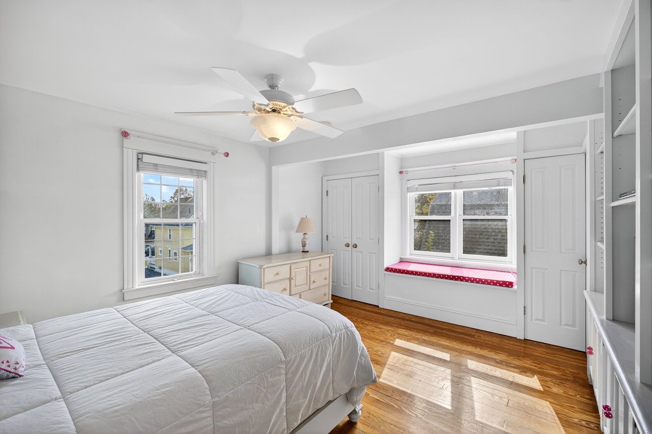 Alternate view of Bedroom #2 with hardwood floors and natural light.