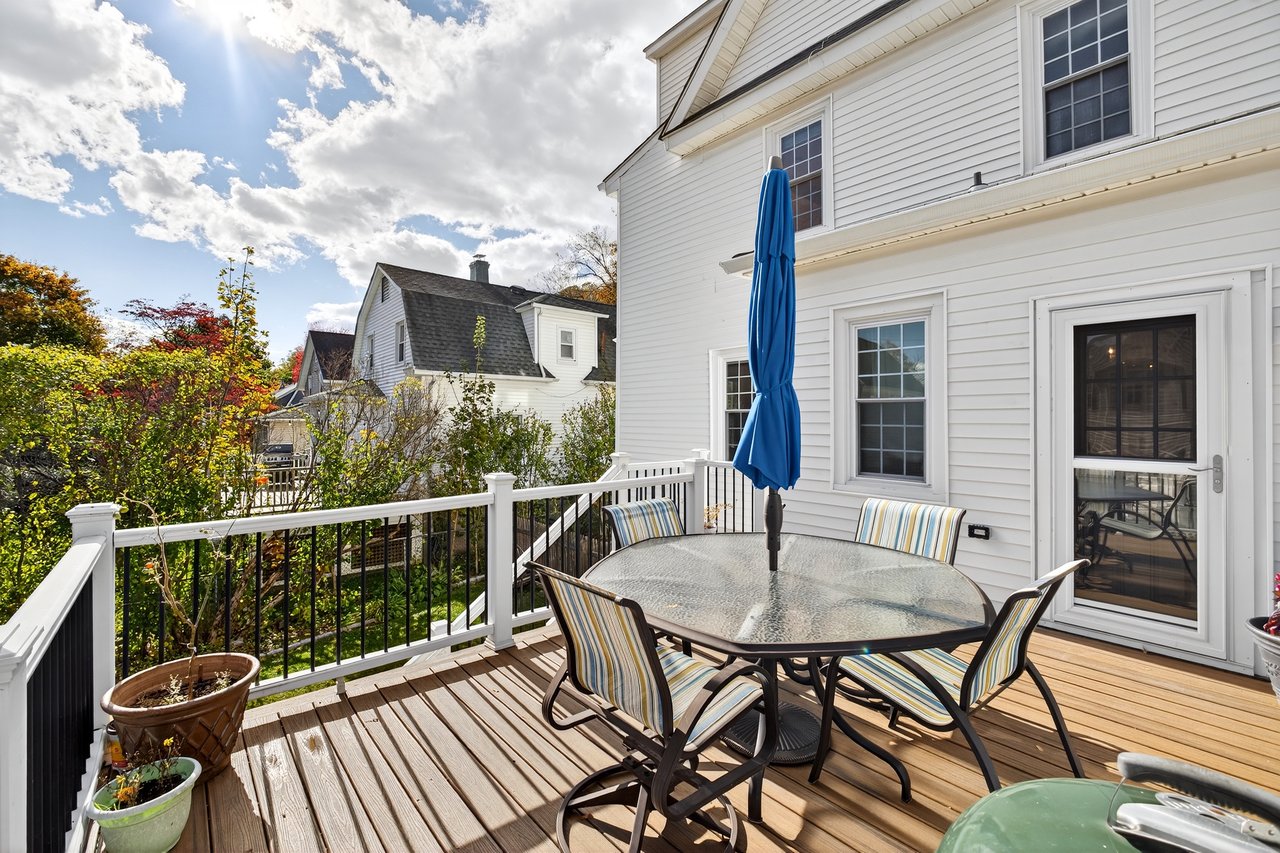 Wooden deck perfect for entertaining. Access to the yard and the kitchen.