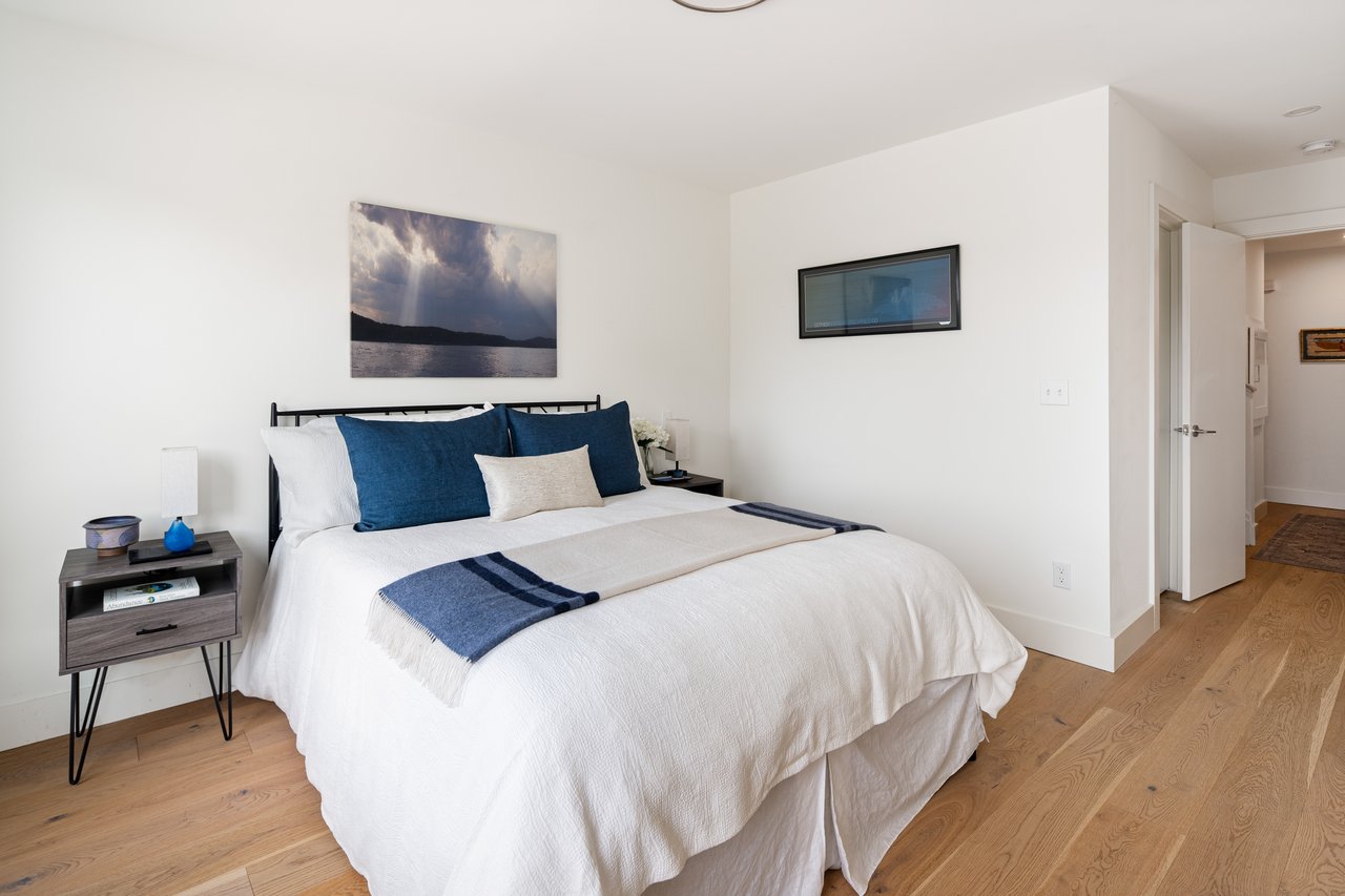 The primary suite offers a large walk-in closet, elegant en-suite bathroom and attached office/ dressing room