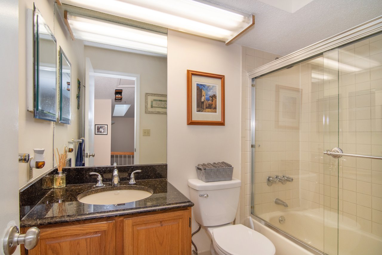 A full hallway bath is perfectly appointed for guests and overnight stays.